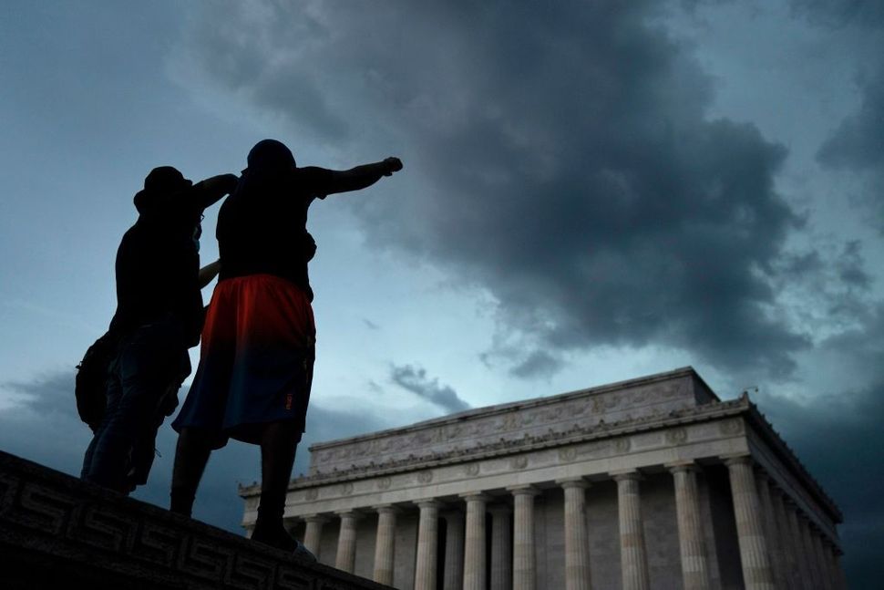 Demonstrators peacefully protest against police brutality and the death of George Floyd at the Lincoln Memorial on June 4.