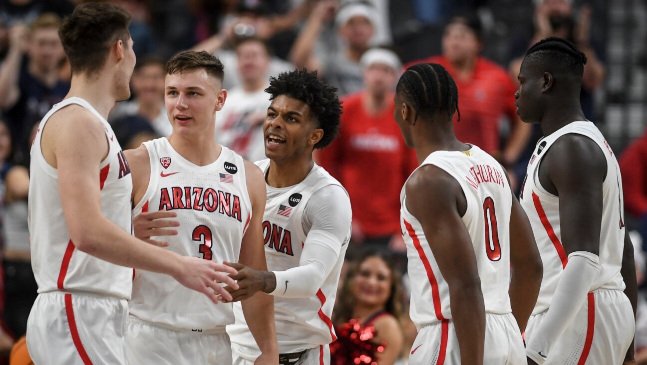 The Arizona Wildcats celebrate during the semifinal PAC-12 conference tournament game at T-Mobile Arena in Las Vegas, March 11, 2022. (AAron Ontiveroz/MediaNews Group/The Denver Post via Getty Images)