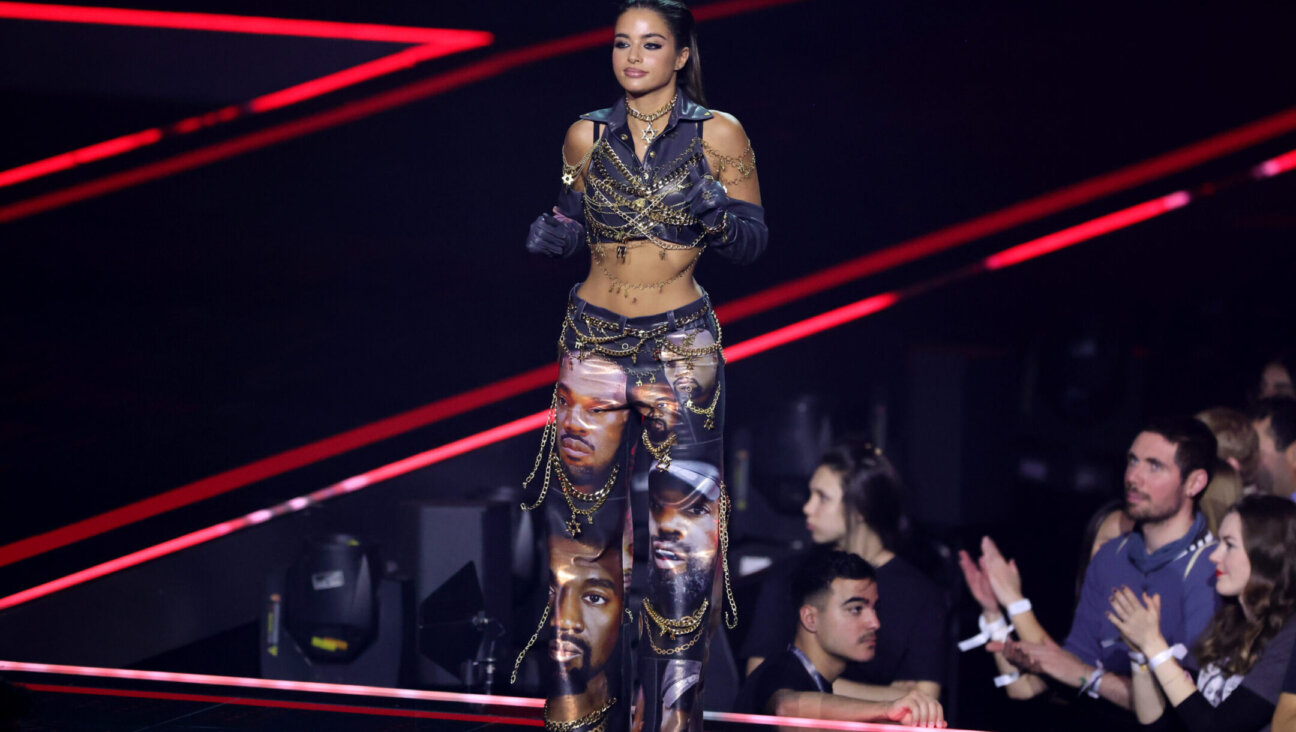 Israeli singer Noa Kirel wears a Kanye West-printed outfit on stage during the MTV Europe Music Awards 2022 in Dusseldorf, Germany, Nov. 13, 2022. (Andreas Rentz/Getty Images for MTV)
